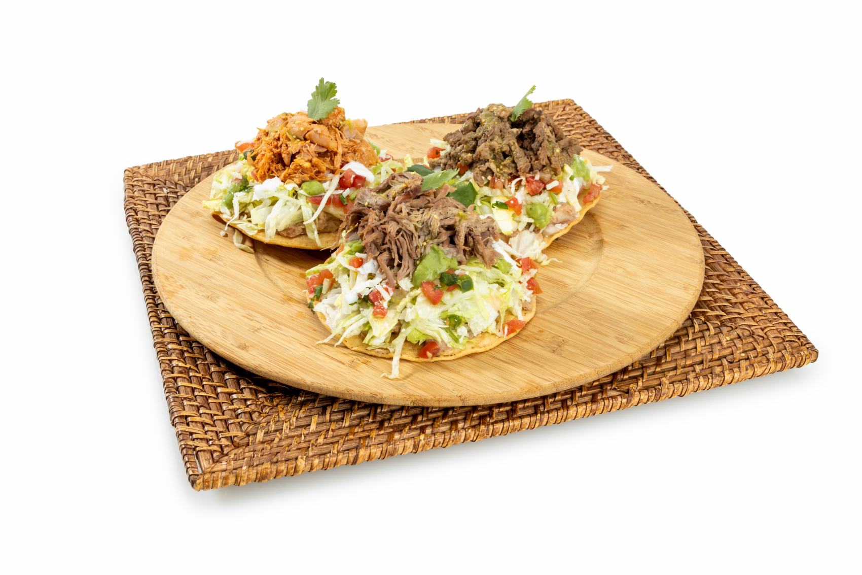 Combo #2 Tostada: A crunchy, fresh, and flavorful combo featuring two crisp tostadas topped with refried beans, shredded lettuce, pico de gallo, crema, cheese, and your choice of meat. Served with authentic Mexican rice and refried beans for a complete and satisfying meal.